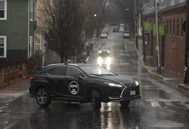 Cars driving fast on both sides of the highway