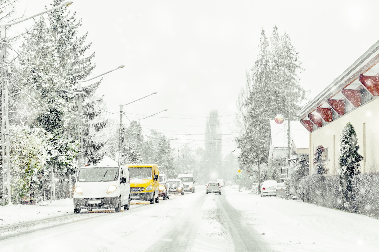 Winter street where autonomous vehicles may struggle to localize due to traditional sensors struggling in these conditions.